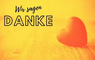 Herzfigur, daneben der Titel "Wir sagen Danke"
